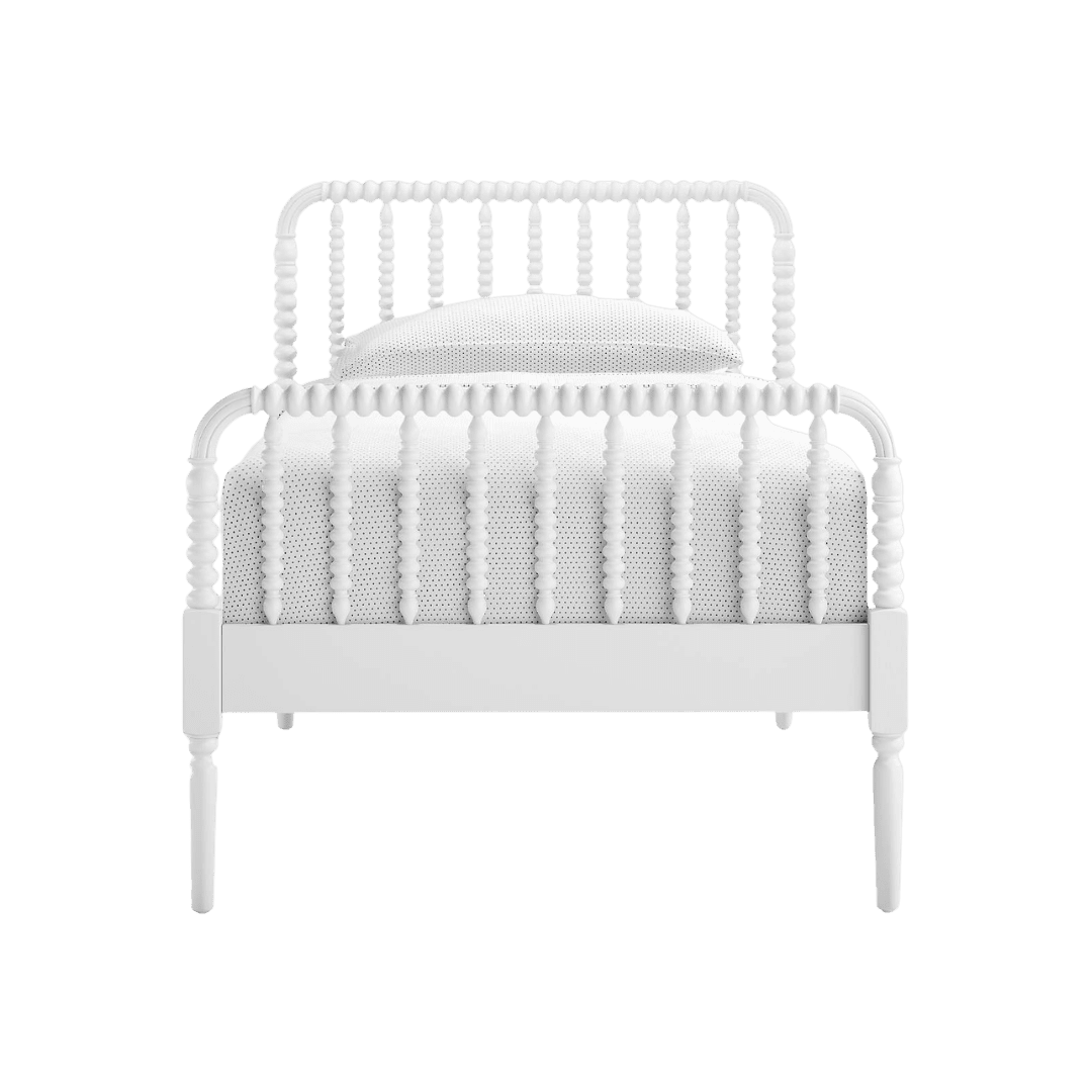 White wooden bed with spindle rails and a mattress inside.