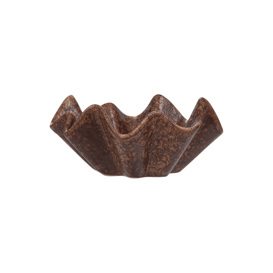 Flower-shaped dark chocolate bowl with ridged petals as a dessert cup.