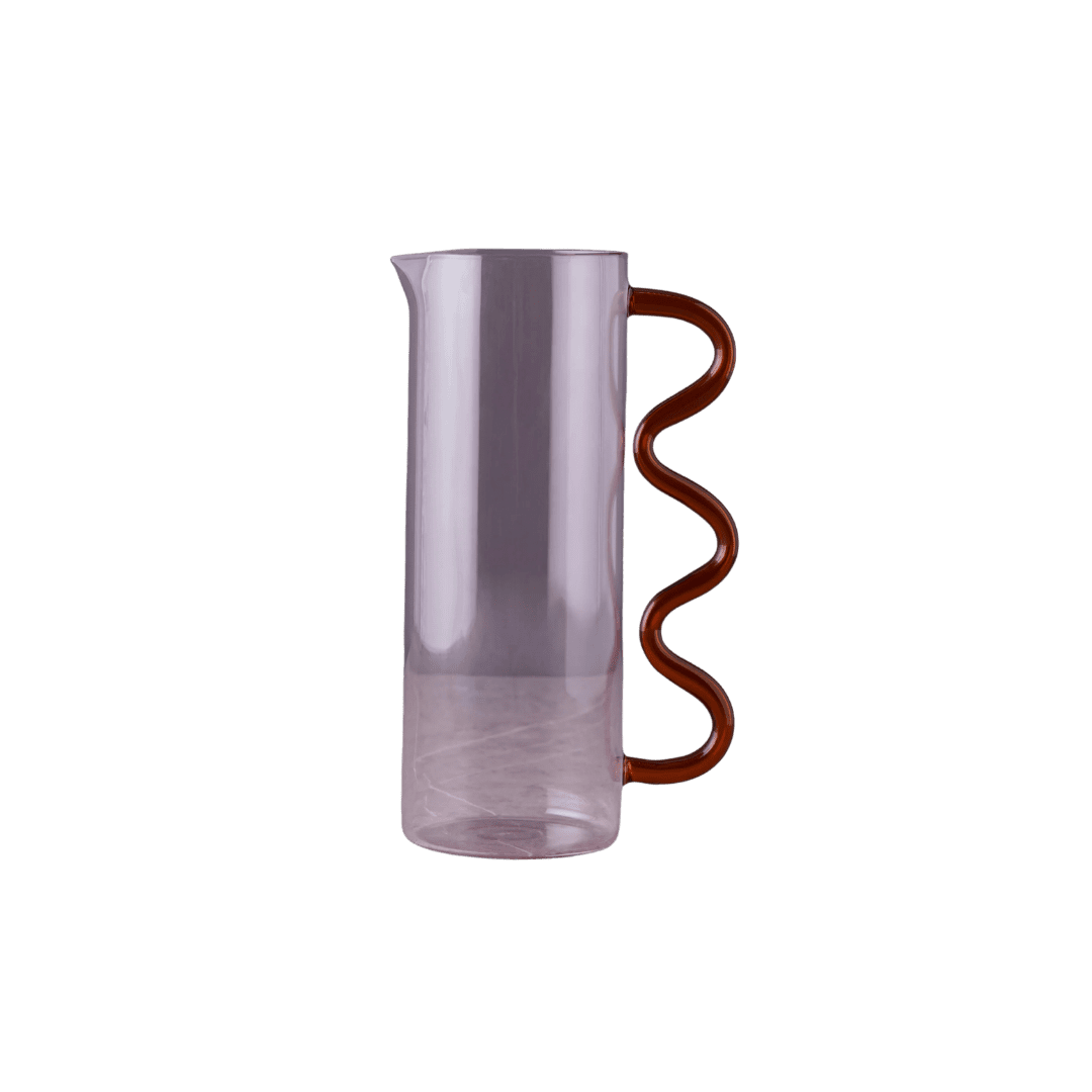 Tall transparent glass carafe with a brown spiral handle against a black background, empty and sleek.