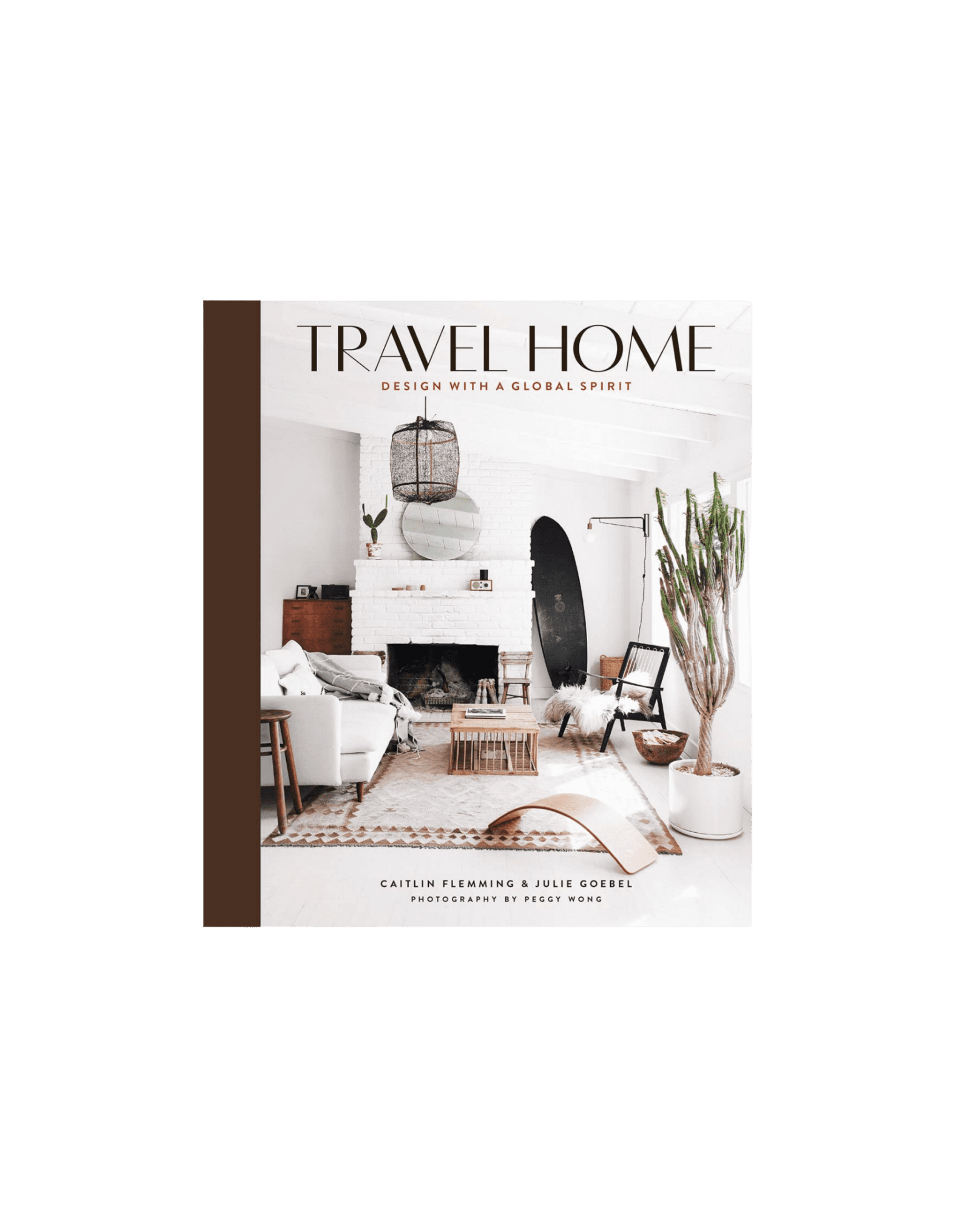 Cover of Travel Home magazine showing a bright, modern living room with a white fireplace, plants, and neutral furnishings.