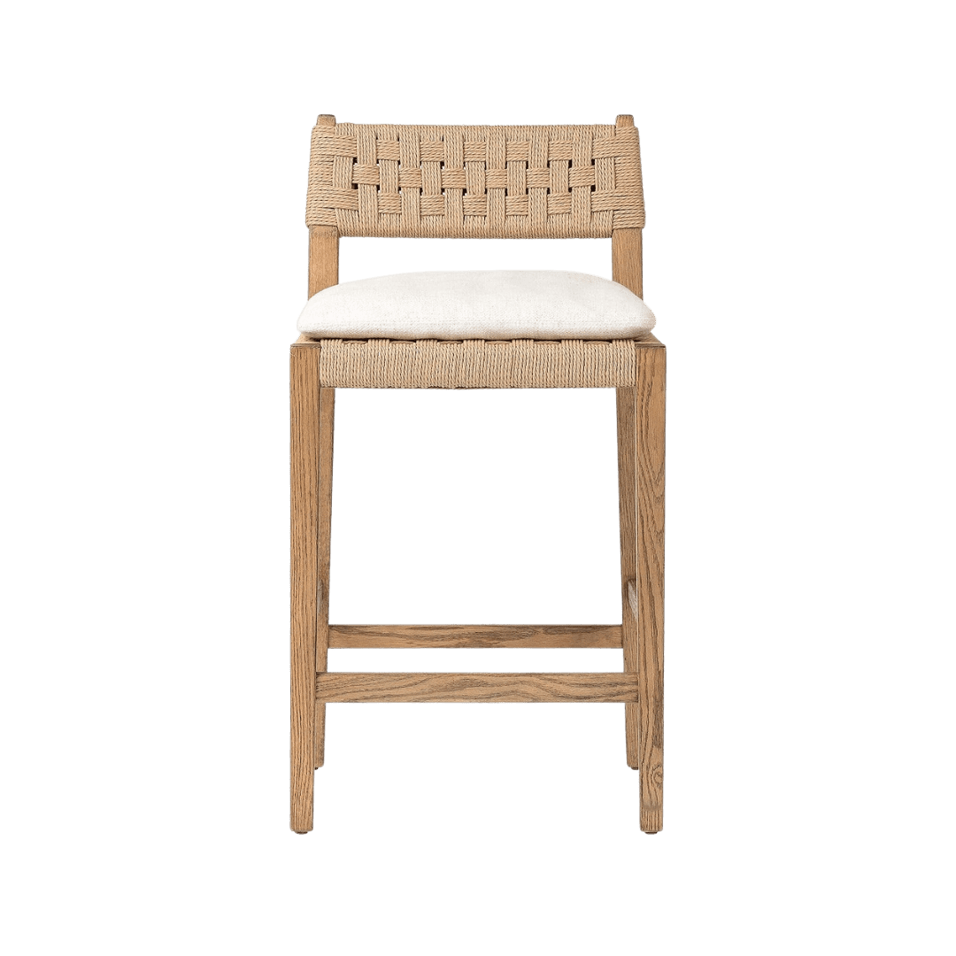 Wooden bar stool with a woven rattan back and a light beige cushion on the seat