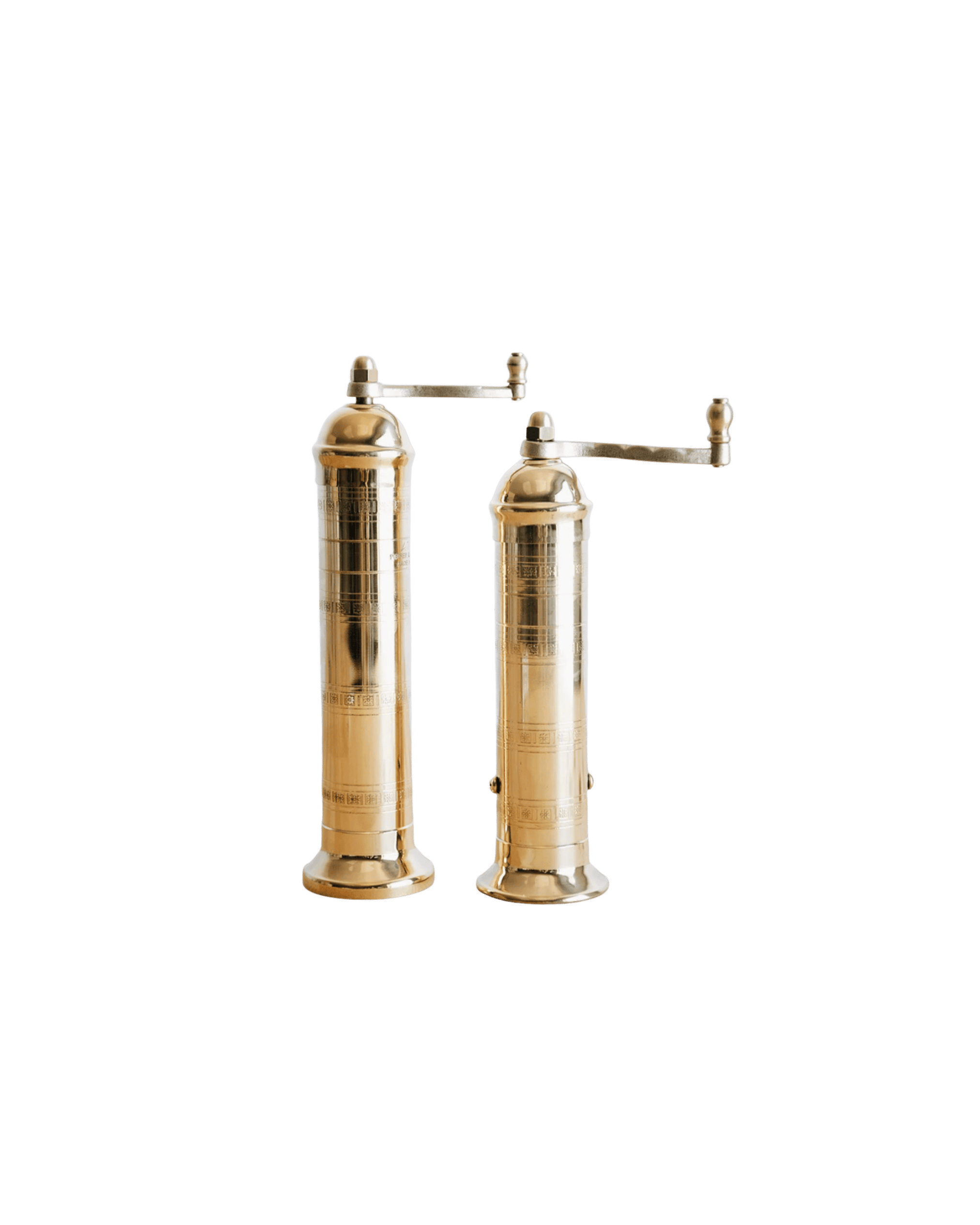 Two tall antique brass siphon dispensers with horizontal side levers, set against a black background.