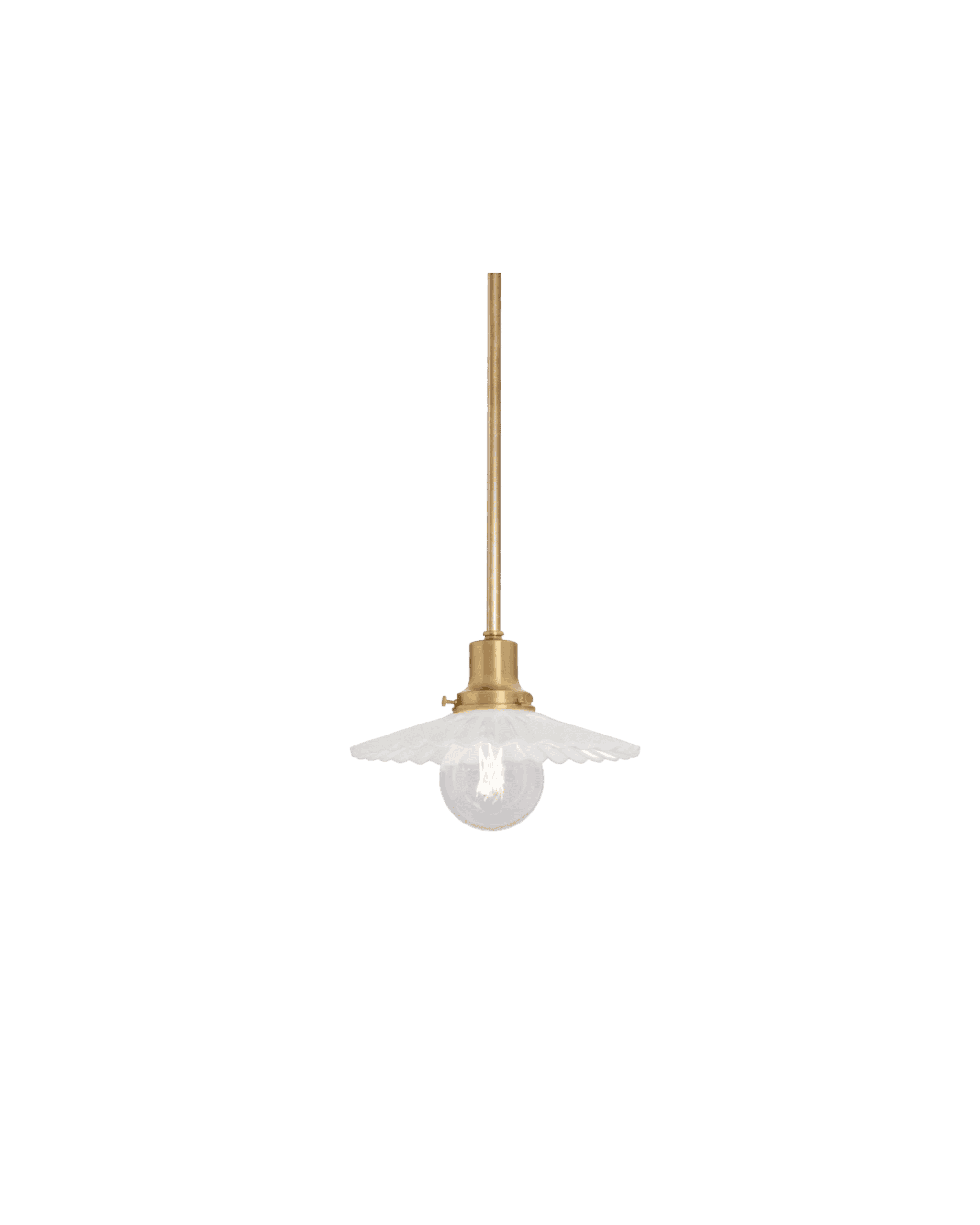 Gold pendant light with a slender brass rod and a white scalloped glass shade against a black background, hanging fixture in mid-air