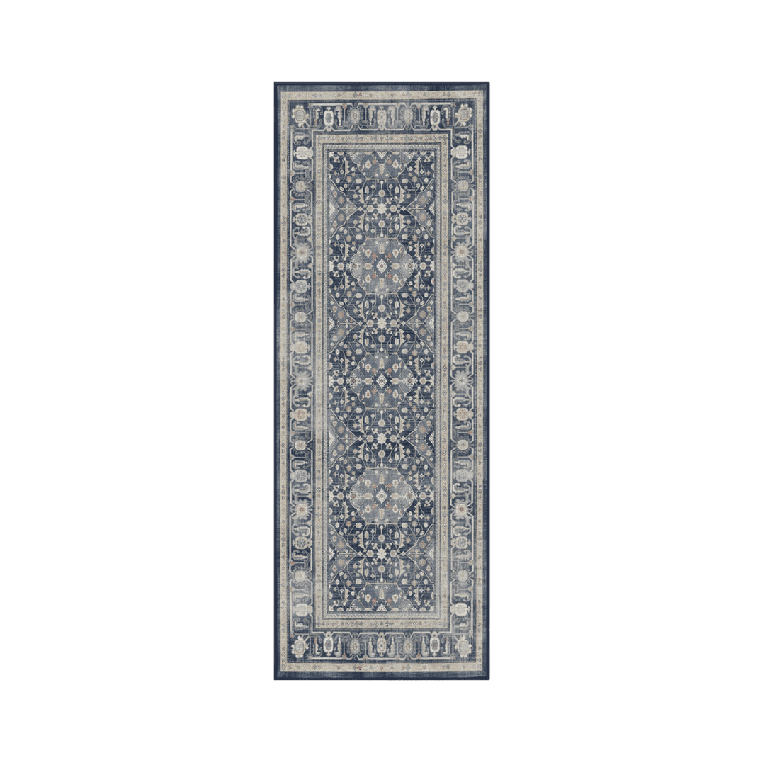 Navy blue patterned rug runner with intricate ivory and light blue designs along a narrow rectangular shape