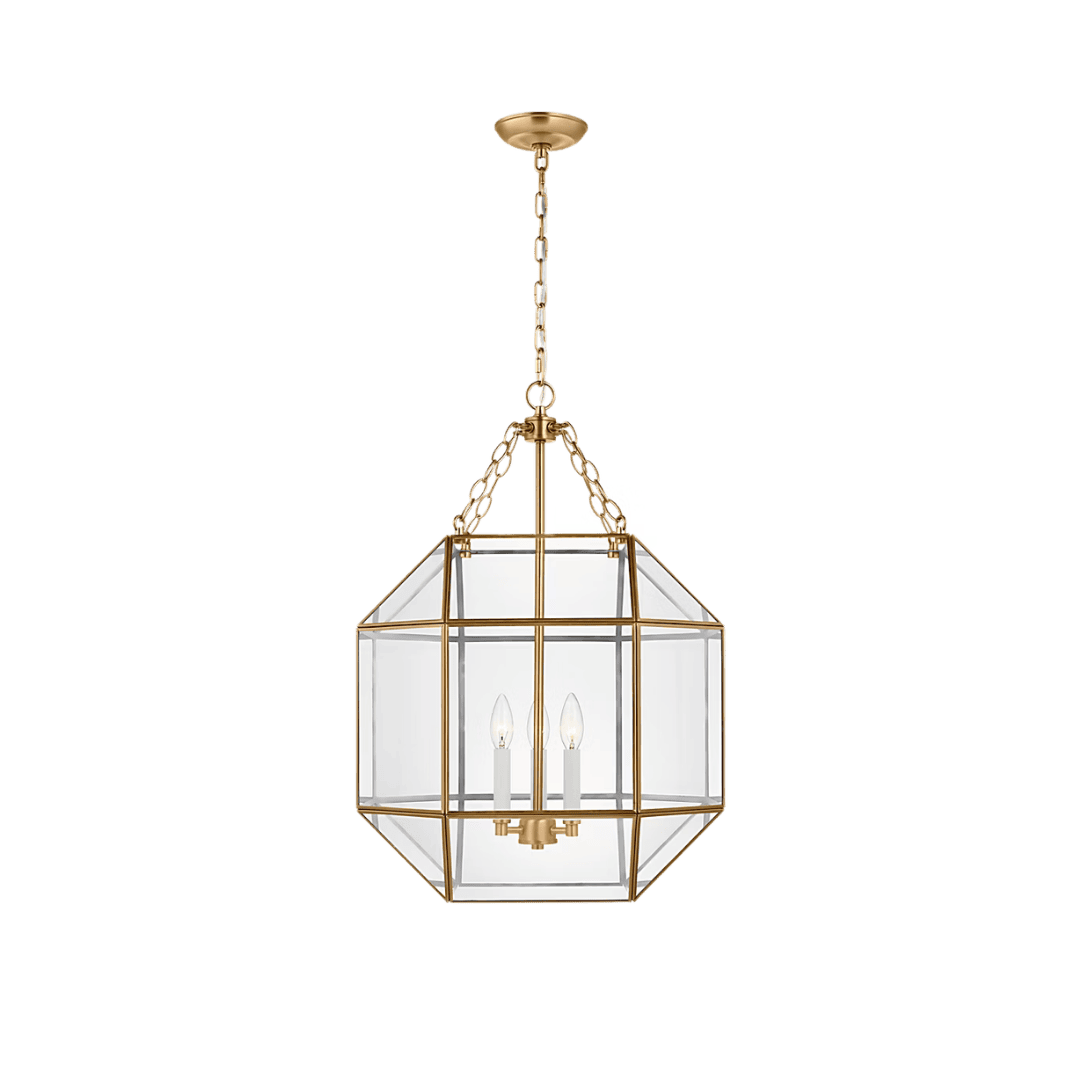 Gold geometric glass pendant light hanging from a chain with two candle bulbs inside