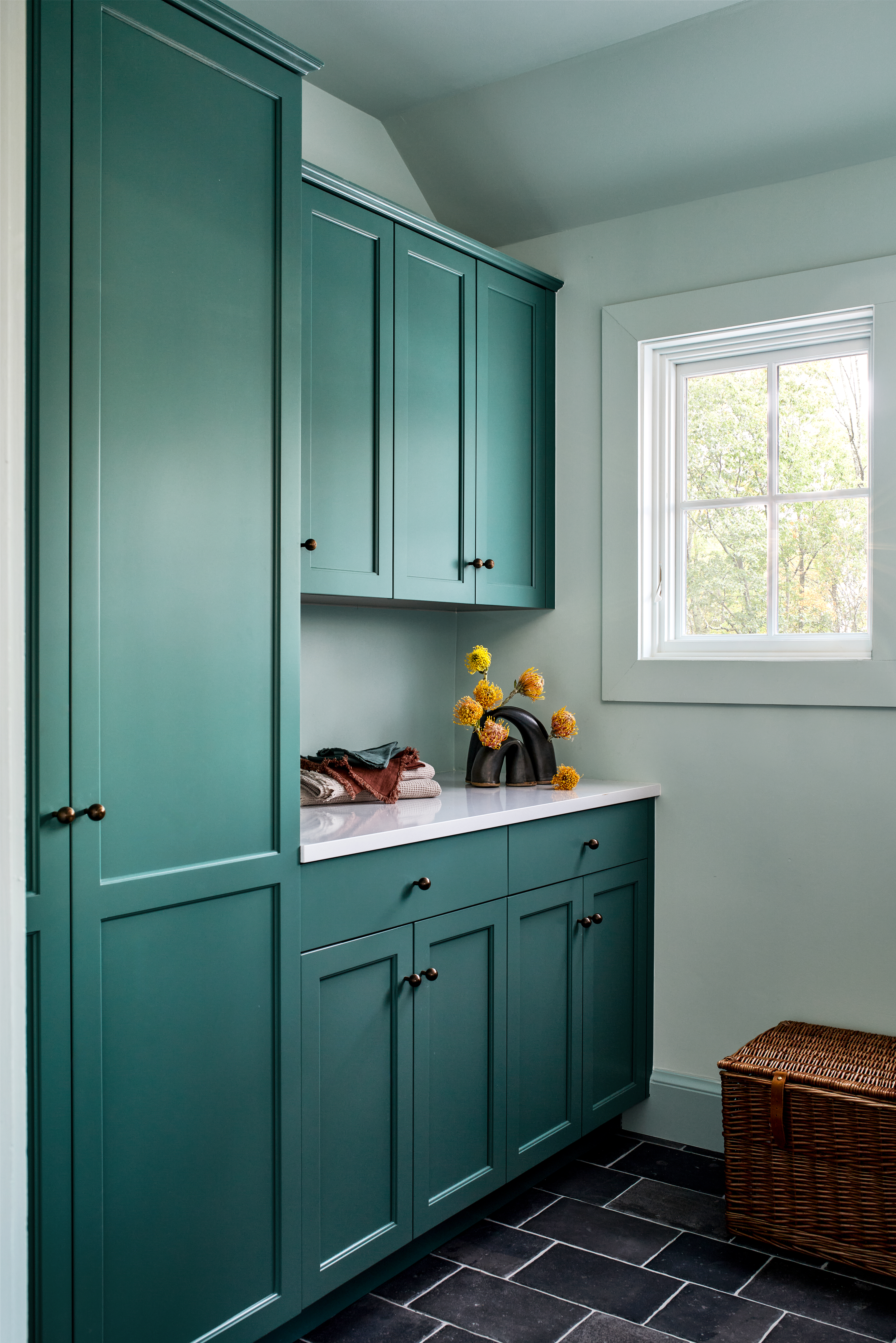 Teal cabinets in laundry room