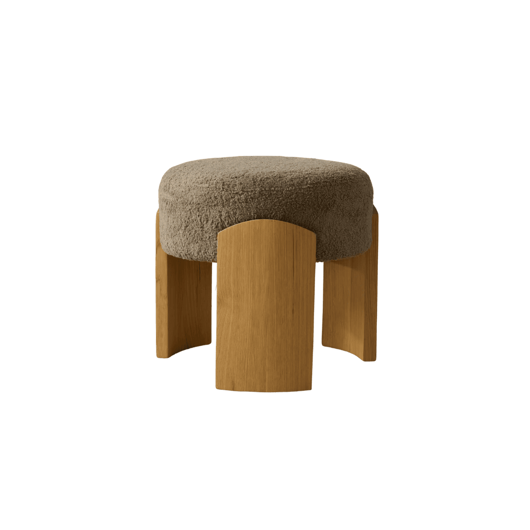 Round ottoman with thick beige boucle cushion and four curved wooden legs in a warm oak finish