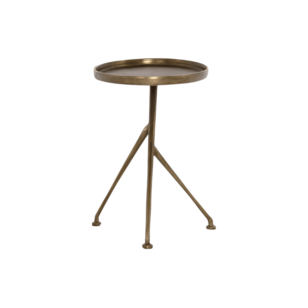 Bronze metal round-top tripod side table with three splayed legs on a floor.