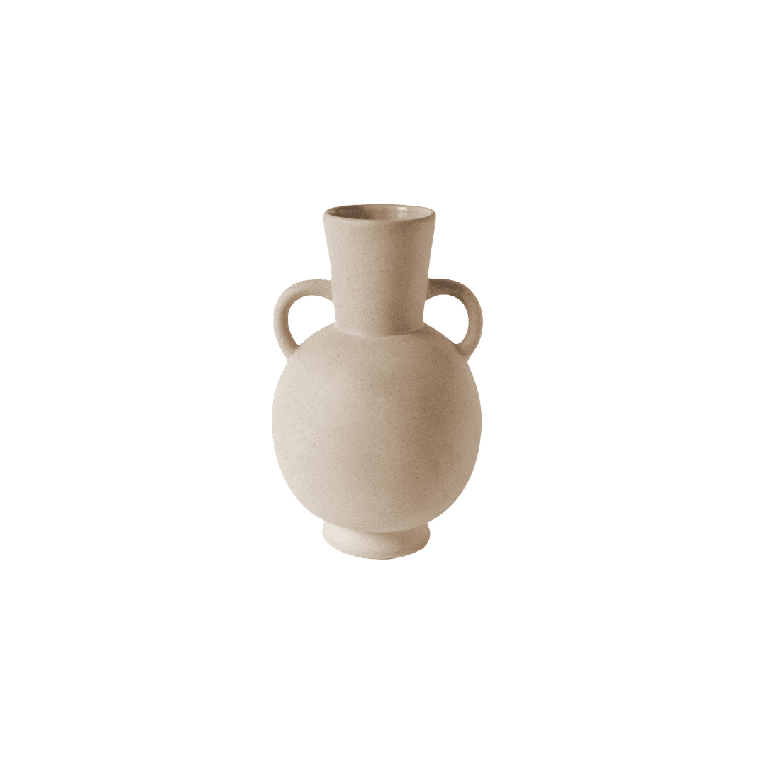 Beige ceramic vase with two curved handles and a bulbous body, empty on a green background.