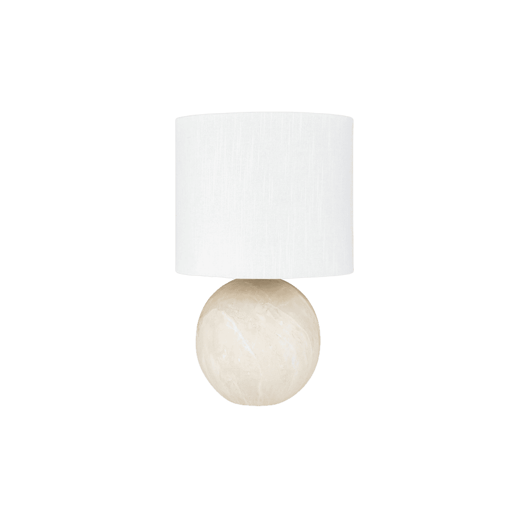 Table lamp with a white fabric drum shade and a round beige marble base.