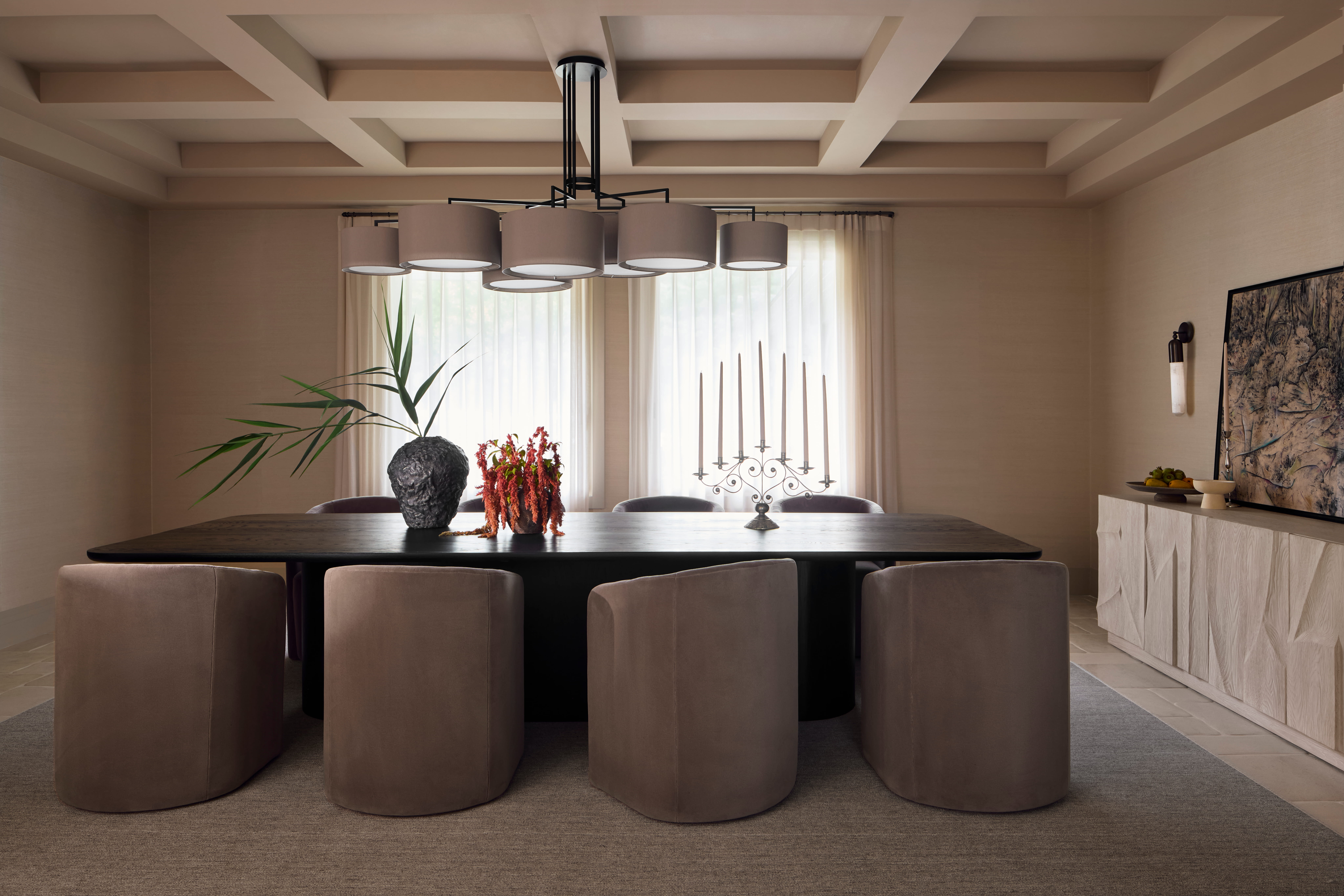 long dining table with chandelier above