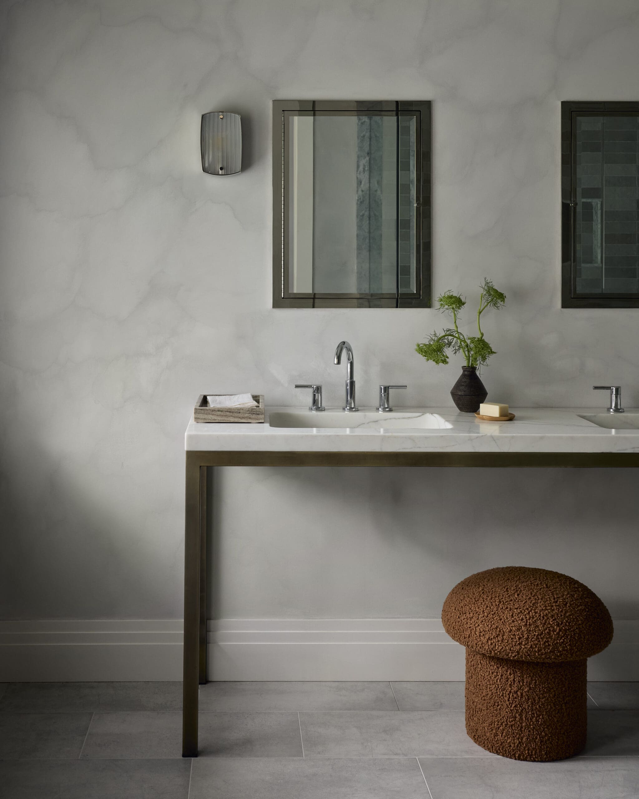 bathroom sink with limestone walls
