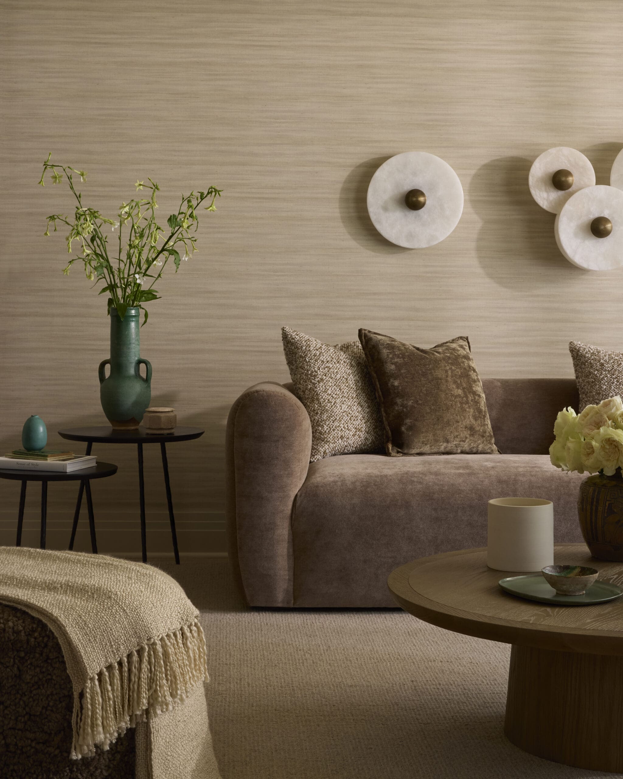 Textured wallpaper and brown sofa